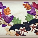 Halloween Baltimore Style Applique Quilt Bat and Broomstick Close Up